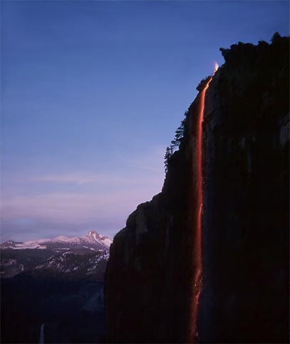 Yosemite Firefall, Mt. Clark (background), and Nevada Fall (lower left corner).<br />
Photographed by Richard Marklin on May 18, 1963 via YosemiteFireFall.org